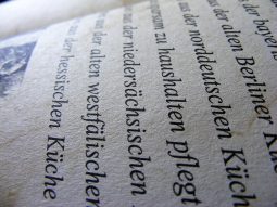 It's a photo of a sideways page of text in a language that your faithful alt texter cannot read. Here's a sample word: niedersächsischen. No one would do that but Germans and their ancestors. I simply searched our media library on the word "German" and it came up along with some recognizable Germanic Philology textbooks and Wheelock's Latin, so there you go.