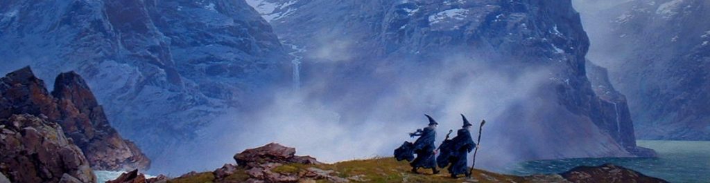 Jagged snow-covered mountains with small mortal beings hiking past.