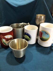 mugs and pewter cups for celebrating community with refreshing and comforting beverages